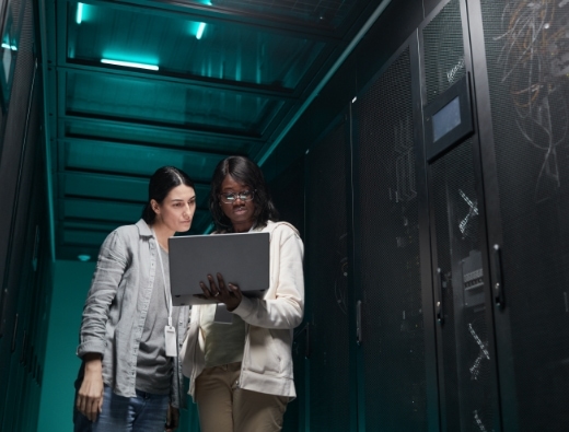 two women standing in security room