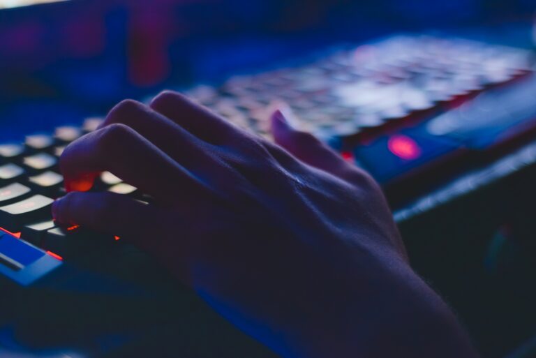 hand types on LED keyboard